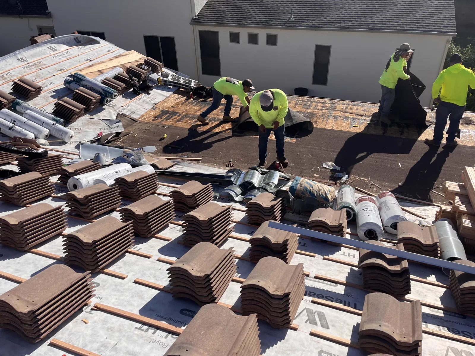 Grand Canyon Roofing crew working together on a tile roof in the Prescott area